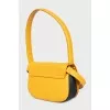 Leather bag with metal logo