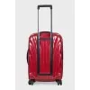 Red suitcase with a relief pattern