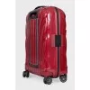 Red suitcase with a relief pattern