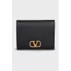 Black leather wallet with gold logo