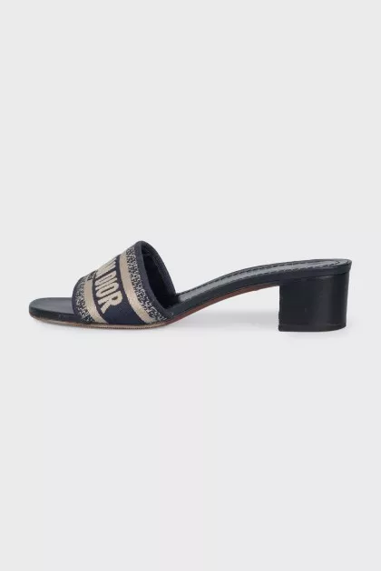 Textile mules with a brand logo