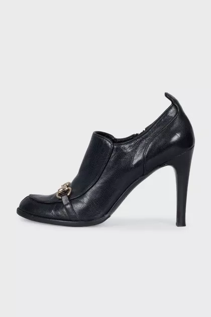 Black shoes with metallic decor