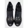 Black shoes with metallic decor