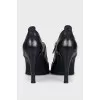 Black shoes with metallic decor