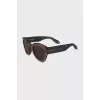 Sunglasses with transparent frames and logo