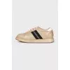 Gold leather sneakers