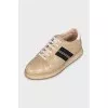 Gold leather sneakers
