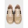 Gold leather sneakers