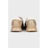 Gold leather sneakers