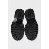 Black loafers with gold decor