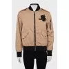 Brown bomber jacket with branded patch