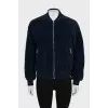 Blue bomber jacket with a zipper
