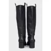 Leather boots in a combination of colors with heels