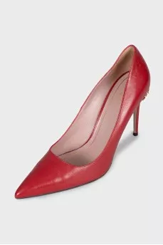 Red leather pumps