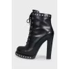 Leather ankle boots with silver decor