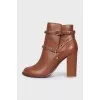 Leather ankle boots with straps and studs