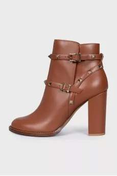 Leather ankle boots with straps and studs