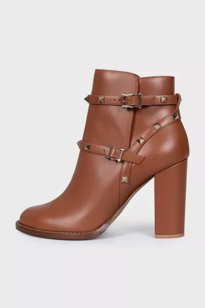 Leather ankle boots with straps and studs