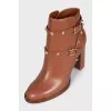 Leather ankle boots with straps and studs