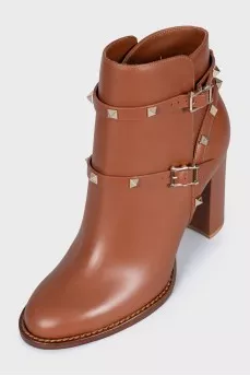 Leather ankle boots with straps and studs