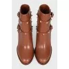 Leather ankle boots with straps and studs