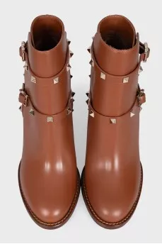 Leather ankle boots with straps and studs