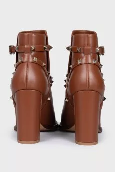 Leather ankle boots with straps and studs
