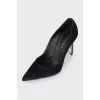 Black suede pumps with heels
