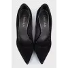 Black suede pumps with heels