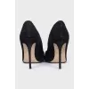 Black suede pumps with heels