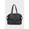 Black leather tote bag with silver hardware