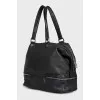 Black leather tote bag with silver hardware