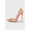 Beige patent leather pumps