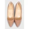 Beige patent leather pumps