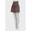 High-waisted pleated shorts