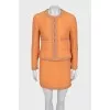 Suit with fitted jacket and miniskirt