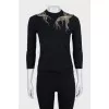 Fitted jumper decorated with beads