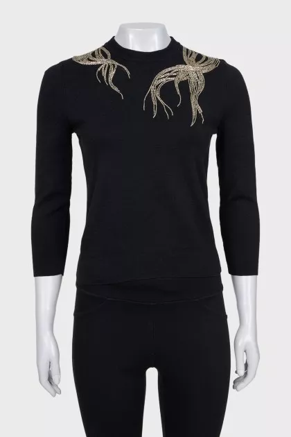 Fitted jumper decorated with beads