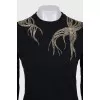 Fitted jumper decorated with beads