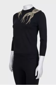 Fitted jumper decorated with beads