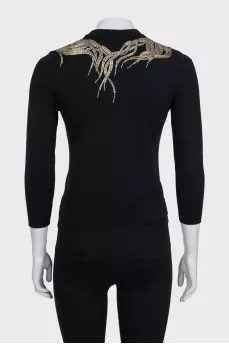 Fitted jumper decorated with beads