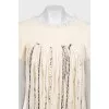 Fitted dress with decorative elements on the front
