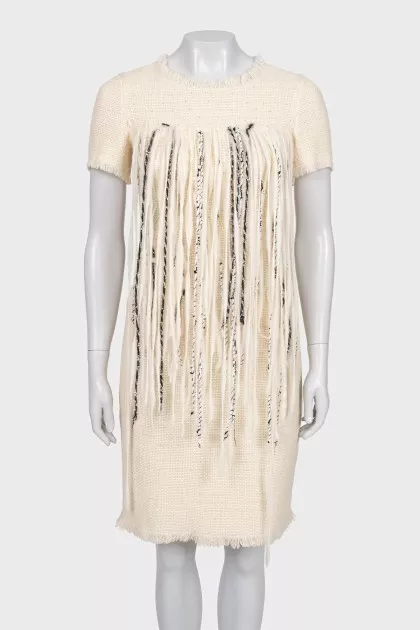 Fitted dress with decorative elements on the front