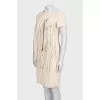 Fitted dress with decorative elements on the front