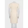 Fitted dress with decorative elements on the front