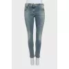 Tapered jeans with a distressed effect