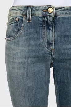 Tapered jeans with a distressed effect