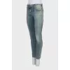 Tapered jeans with a distressed effect