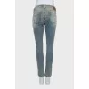 Tapered jeans with a distressed effect