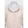 Beige suit with a cardigan and a T-shirt